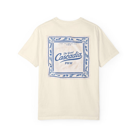 Seastack cream 100% cotton short sleeve tee with a blue graphic on the back featuring "The Great Cascadia PNW" text.